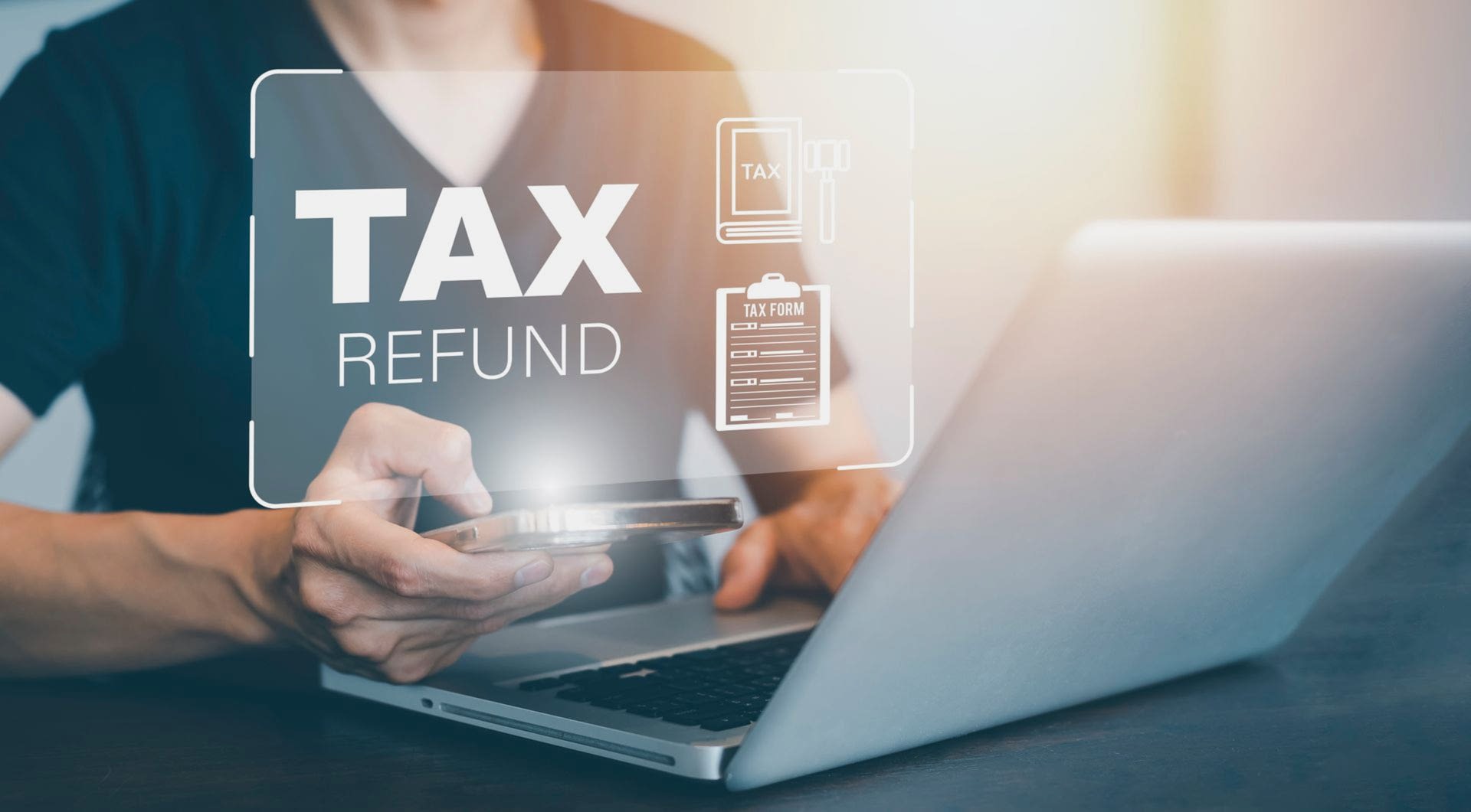 Hand Using Tablet With Bar Tax Refund And Refund Tax Of 21056320